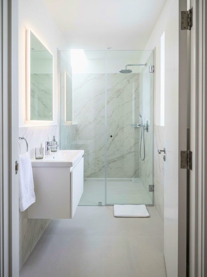 frameless door for a curbless shower