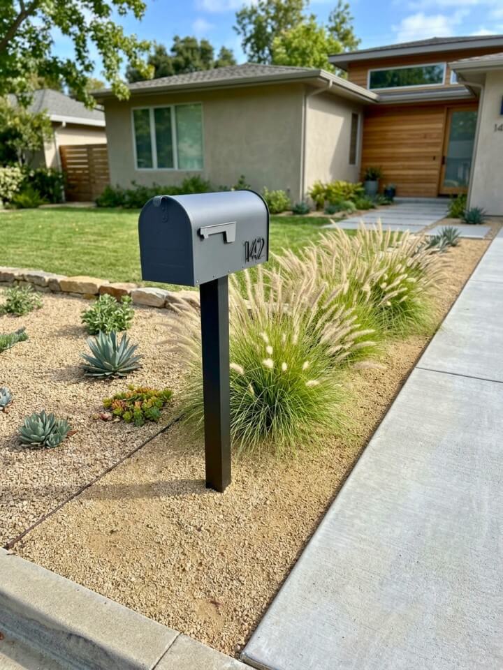gravel mailbox bed with ornamental grass