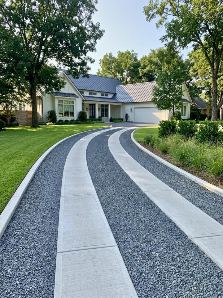 gravel driveway with concrete ribbon tracks