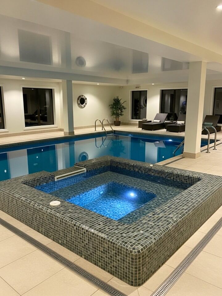 indoor pool design with built in hot tub