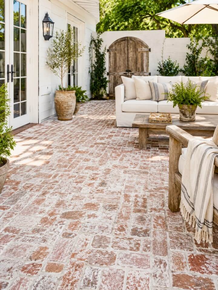 aged brick patio with whitewash finish